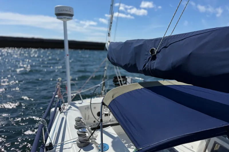 Slide: The Image of Sailing on a 1994 J Boats J/120 with blue sail cover and Garmin equipment. - 65