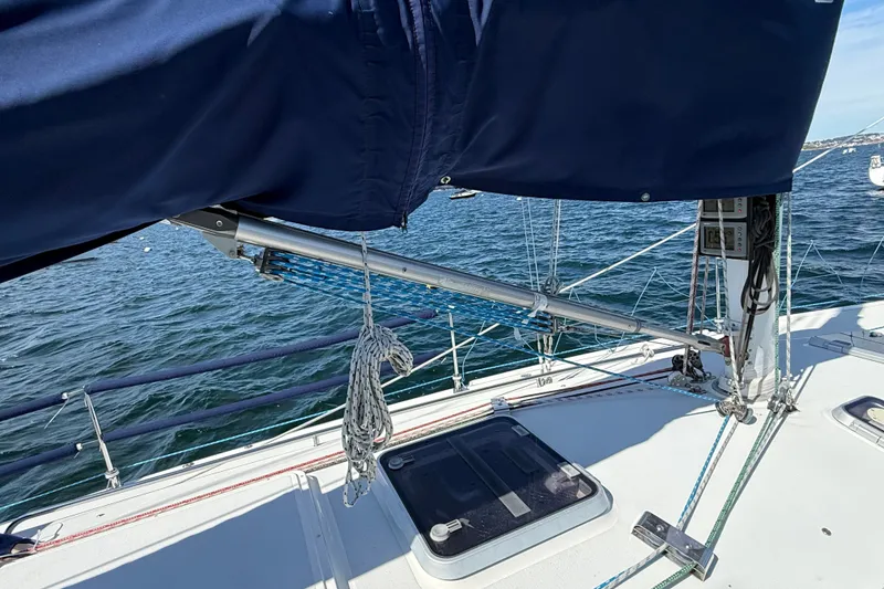 Slide: The Image of Sailboat deck view of a 1994 J Boats J/120, featuring rigging and ocean backdrop. - 58