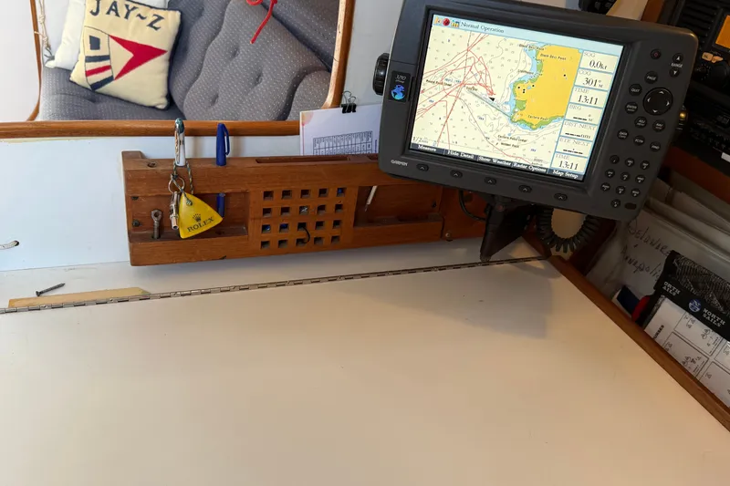 Slide: The Image of Navigation station on a 1994 J Boats J/120 with chart plotter and nautical decor. - 30