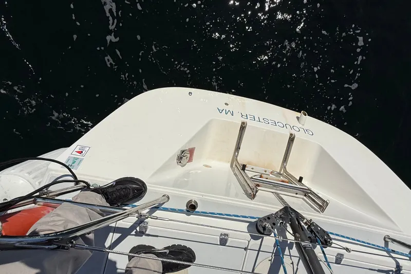 Slide: The Image of Overhead view of a 1994 J Boats J/120 sailboat deck with ladder and ocean backdrop. - 68