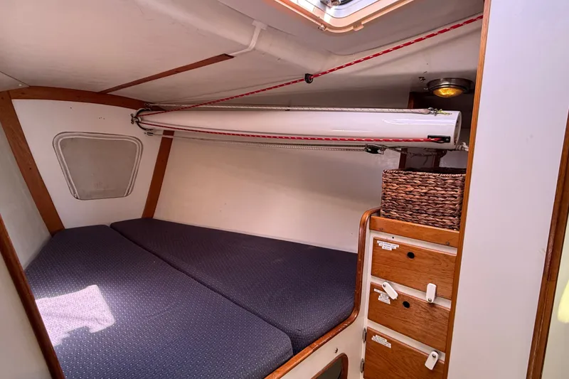 Slide: The Image of Cozy cabin interior of 1994 J Boats J/120 with bed and storage compartments. - 40