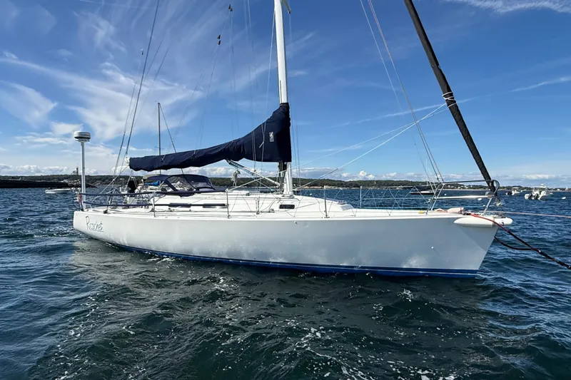 The Image of 1994 J Boats J/120 sailboat on water under clear blue sky. - 1