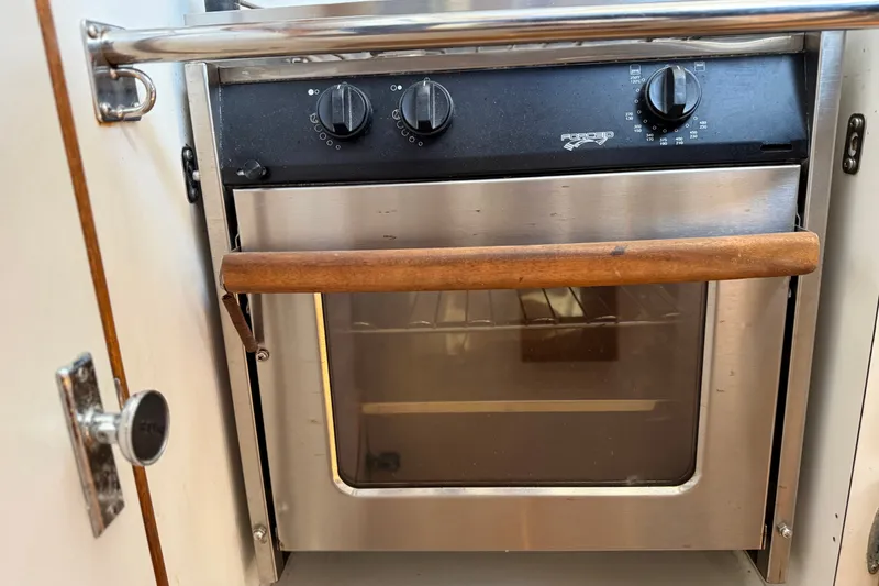 Slide: The Image of Stainless steel oven with wooden handle on a 1994 J Boats J/120 yacht. - 26