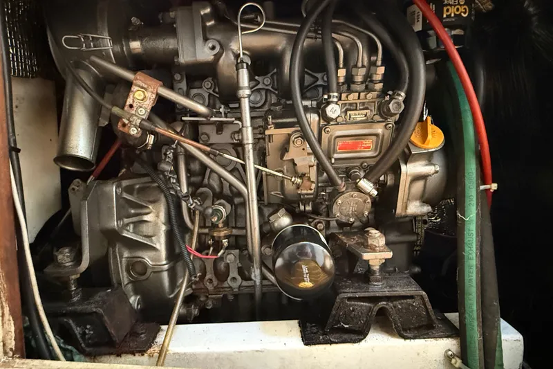 Slide: The Image of Engine of a 1994 J Boats J/120 sailboat, showcasing intricate mechanical components. - 79