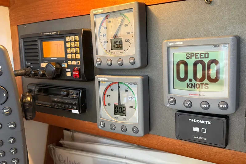 Slide: The Image of Navigation instruments on a 1994 J Boats J/120 yacht dashboard, displaying speed and wind data. - 31