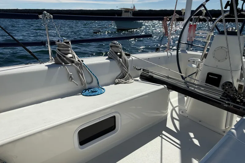Slide: The Image of Cockpit of a 1994 J Boats J/120 sailboat with ropes and steering wheel. - 72