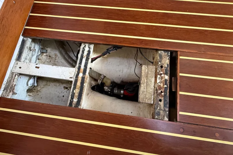 Slide: The Image of Open wooden floor panel on a 1994 J Boats J/120, revealing internal components. - 86