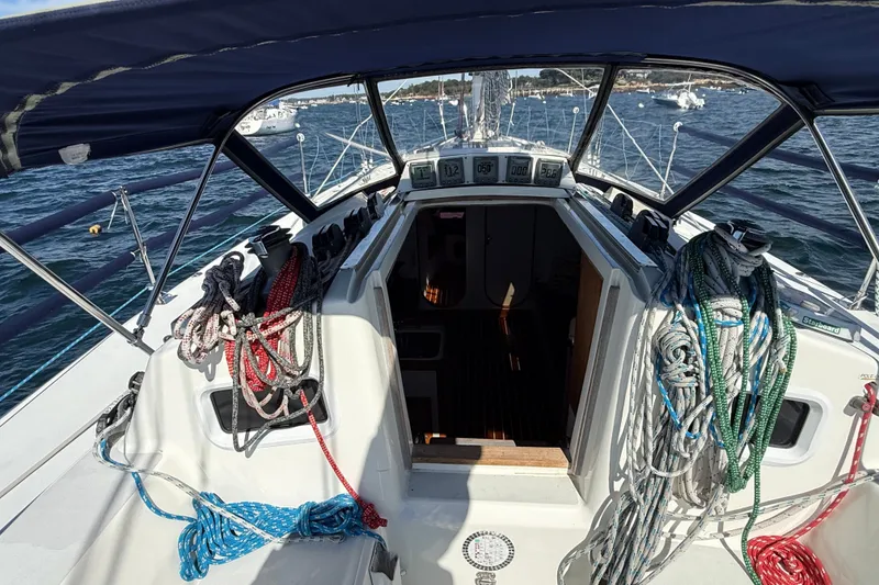 Slide: The Image of Cockpit view of 1994 J Boats J/120 sailboat with ropes and instruments. - 54