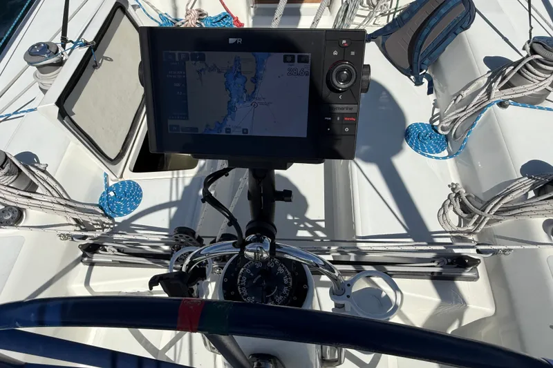 Slide: The Image of Cockpit of 1994 J Boats J/120 with navigation equipment and steering wheel. - 51