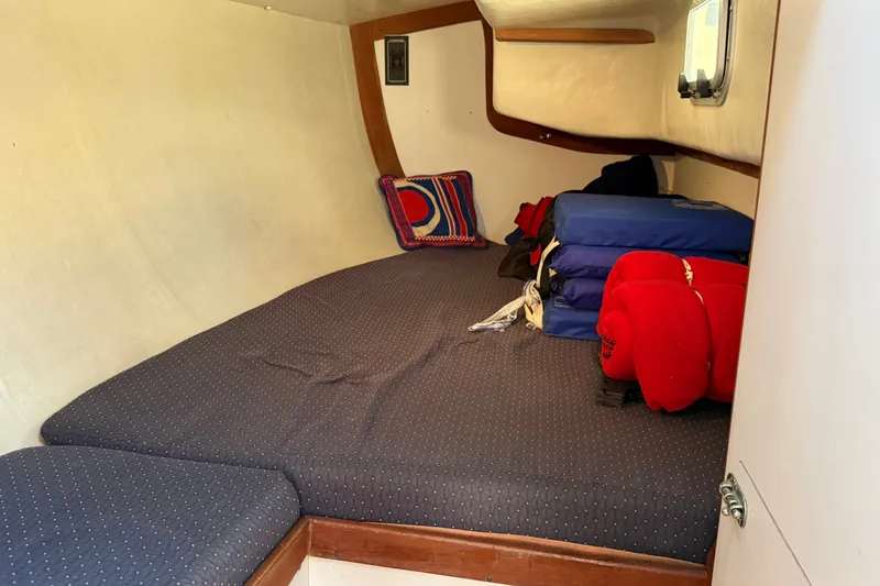 Slide: The Image of Cozy cabin interior of 1994 J Boats J/120 with cushions and nautical decor. - 44