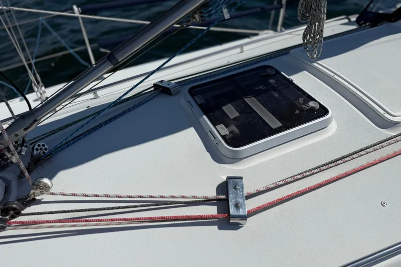 Slide: The Image of Deck of 1994 J Boats J/120 sailboat with ropes and hatch. - 63