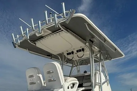 Slide: The Image of Spectre 37 boat, 2009 model, featuring a T-top with rod holders against a blue sky. - 5