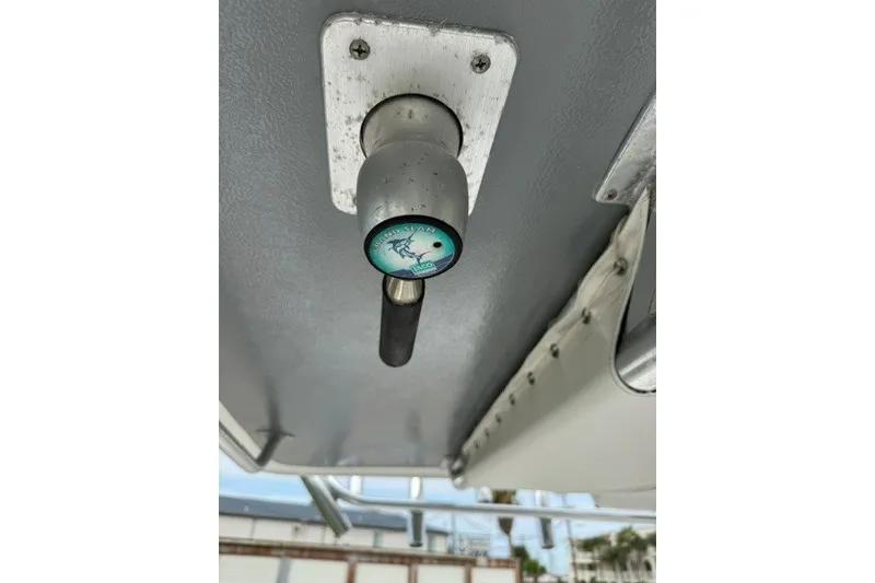 Slide: The Image of Boat canopy lever on a 2009 Spectre 37, featuring a TACO Marine handle. - 35