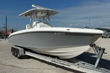 The Image of 2009 Spectre 37 boat on trailer under clear blue sky. - 0