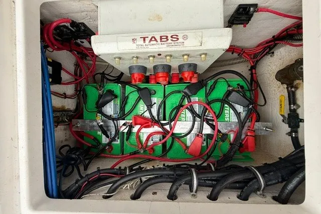 Slide: The Image of Battery compartment of a 2009 Spectre 37 boat with TABS system and wiring. - 32
