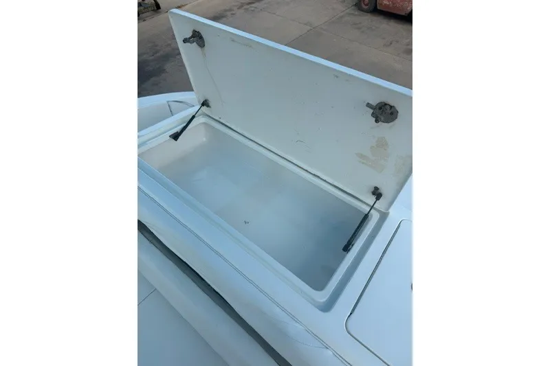 Slide: The Image of Open storage compartment on a 2009 Spectre 37 boat, showcasing interior space. - 18