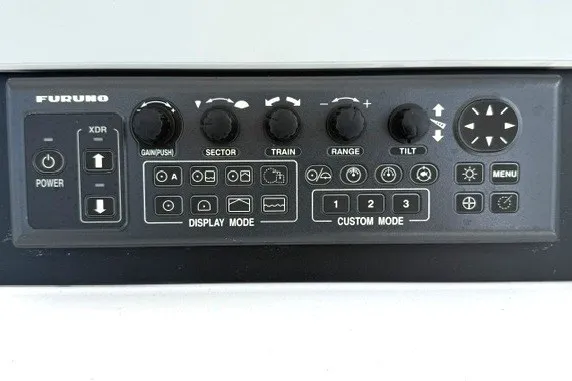 Slide: The Image of Control panel of a Furuno device with various knobs and buttons, Spectre 37, 2009 model. - 11