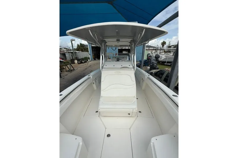 Slide: The Image of 2009 Spectre 37 boat interior with seating and canopy, docked at marina. - 7