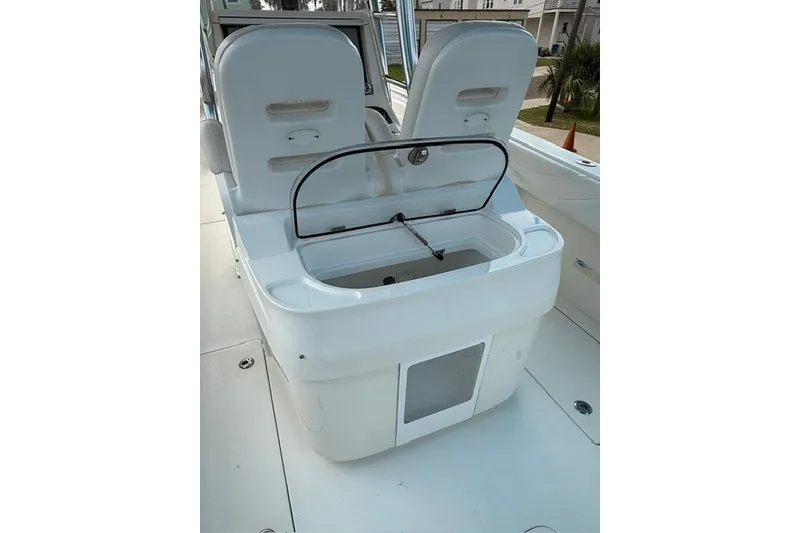 Slide: The Image of 2009 Spectre 37 boat interior with open storage compartment and seating. - 15