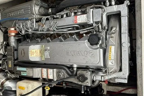 Slide: The Image of Spectre 37 engine, 2009 model, showcasing intricate mechanical components and 24-valve system. - 31