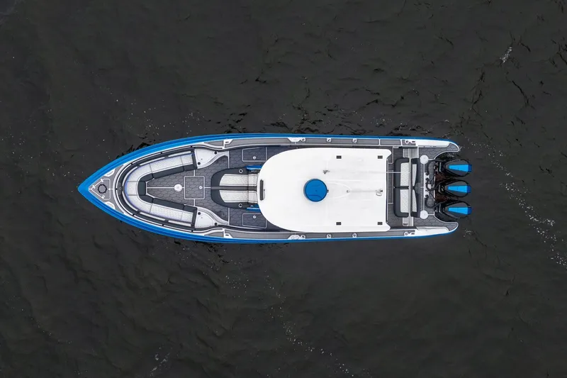Slide: The Image of Aerial view of 2022 Fountain 39 NX boat on dark water. - 8
