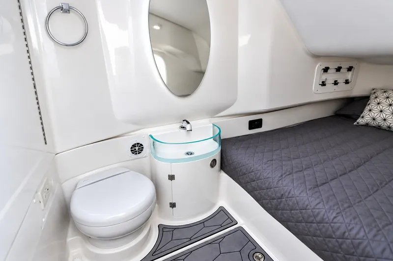 Slide: The Image of 2022 Fountain 39 NX cabin interior with modern bathroom and cozy sleeping area. - 33