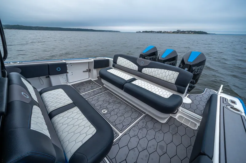 Slide: The Image of 2022 Fountain 39 NX boat interior with stylish seating and powerful engines on open water. - 14