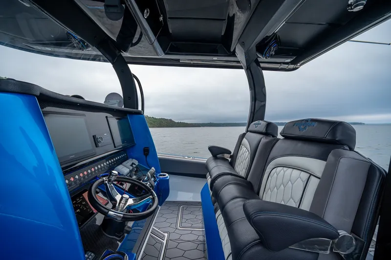 Slide: The Image of 2022 Fountain 39 NX boat interior with modern dashboard and luxurious seating. - 16