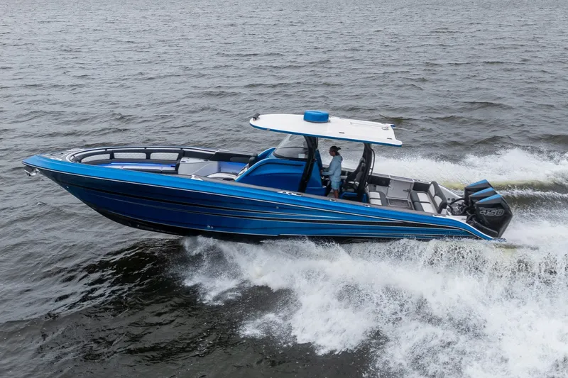 Slide: The Image of 2022 Fountain 39 NX boat cruising on open water, showcasing sleek blue design. - 1