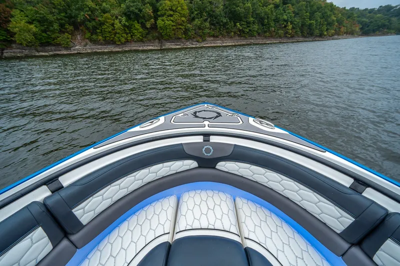 Slide: The Image of Bow view of 2022 Fountain 39 NX boat on a calm lake. - 25