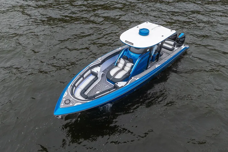 Slide: The Image of 2022 Fountain 39 NX boat in blue on water, aerial view. - 7