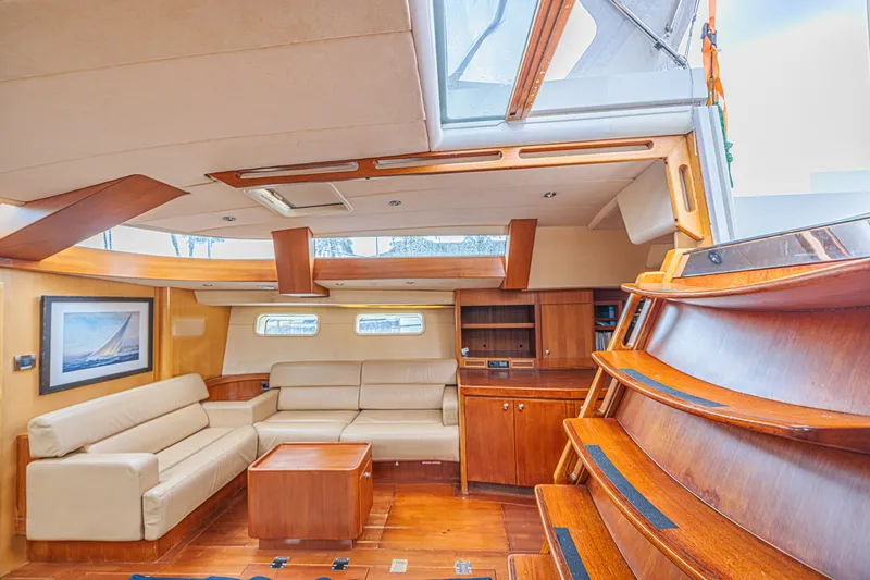 Slide: The Image of Luxurious interior of a 2007 CNB 70 yacht with elegant wood finishes and comfortable seating. - 39