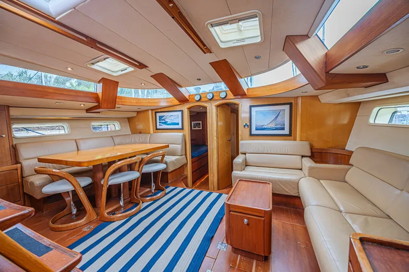 Slide: The Image of Luxurious interior of a 2007 CNB 70 yacht with elegant wood and leather furnishings. - 36