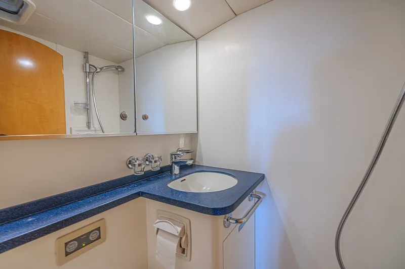 Slide: The Image of Luxurious bathroom in 2007 CNB 70 yacht with modern fixtures and sleek design. - 59