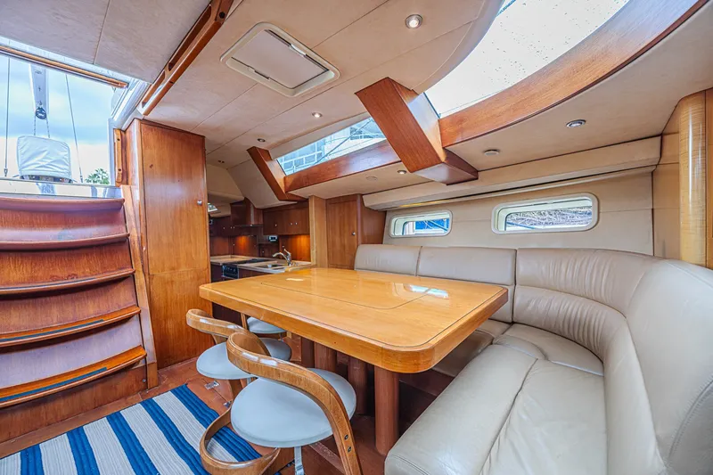 Slide: The Image of Luxurious interior of a 2007 CNB 70 yacht with elegant wood and leather furnishings. - 37
