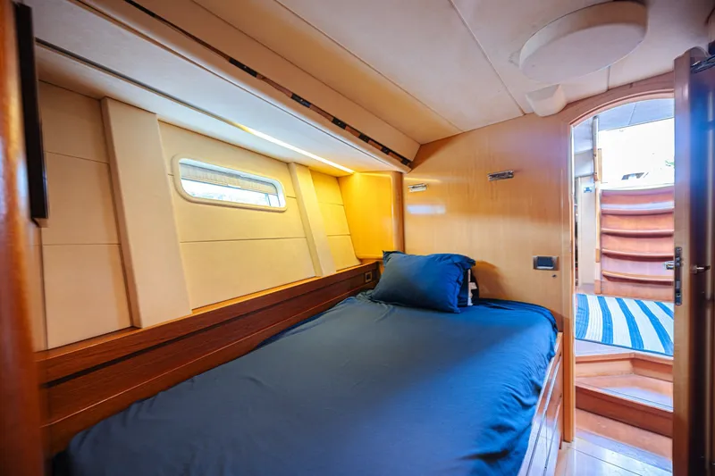 Slide: The Image of Luxurious cabin interior of 2007 CNB 70 yacht with cozy bed and wooden finishes. - 57