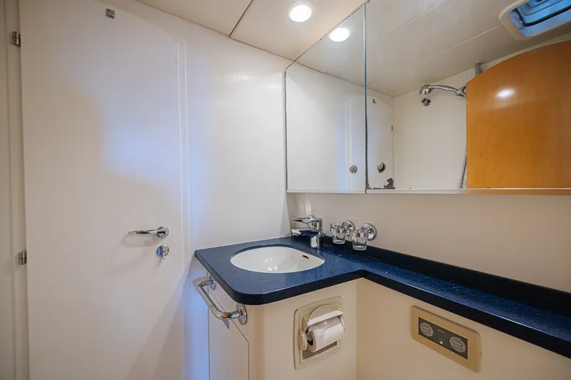 Slide: The Image of Luxurious yacht bathroom with sleek sink, mirror, and modern fixtures on CNB 70, 2007 model. - 56