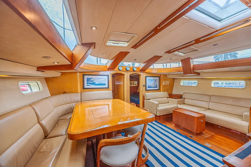 Slide: The Image of Luxurious interior of a 2007 CNB 70 yacht with elegant wood finishes and plush seating. - 40