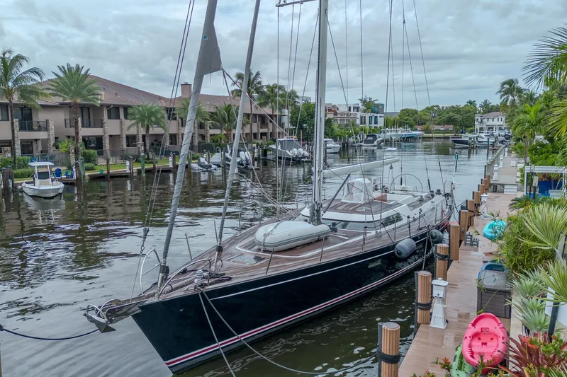 Slide: The Image of Luxurious 2007 CNB 70 yacht docked in a scenic waterfront marina. - 13