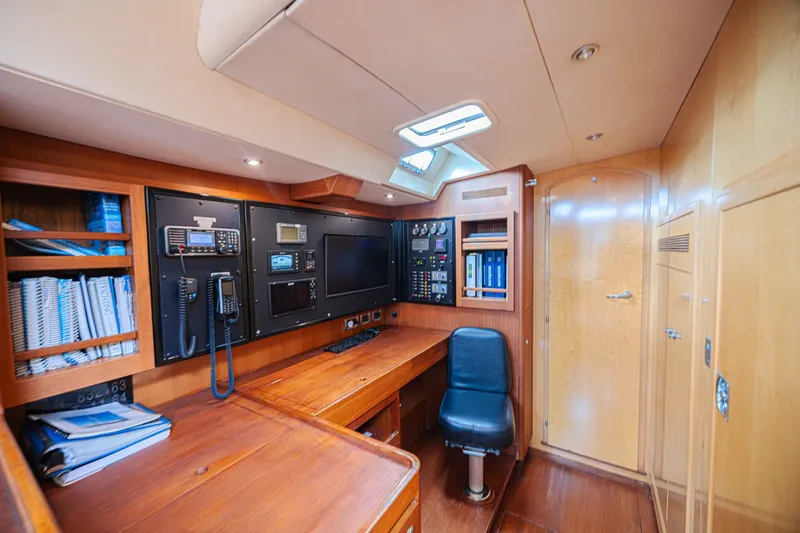 Slide: The Image of Luxurious CNB 70 yacht interior with navigation equipment and wooden furnishings, 2007 model. - 44