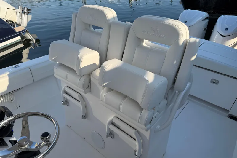 Slide: The Image of Luxury seating on a 2026 Regulator 28 boat, featuring plush white upholstery. - 47