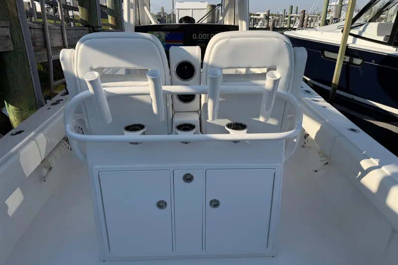 Slide: The Image of 2026 Regulator 28 boat interior with rod holders and storage compartments. - 30