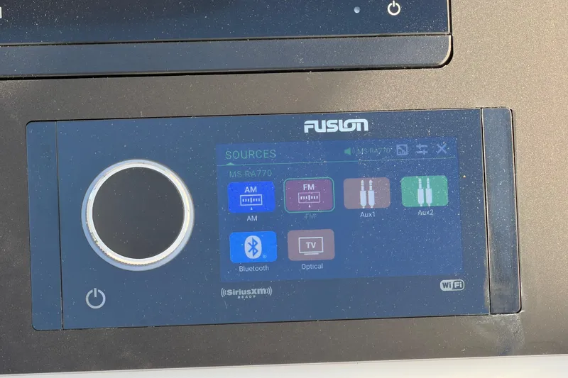Slide: The Image of Fusion MS-RA770 audio system interface on 2026 Regulator 28 boat dashboard. - 40