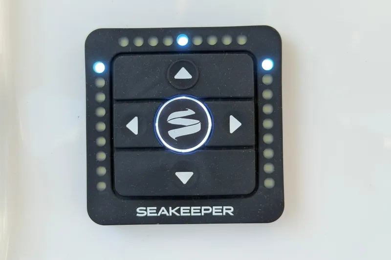 Slide: The Image of Seakeeper control panel on 2026 Regulator 28 boat, featuring illuminated buttons. - 45