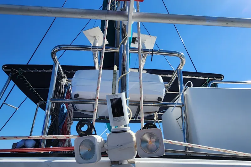 Slide: The Image of 2008 Lagoon 500 yacht deck with rigging and equipment under clear blue sky. - 27