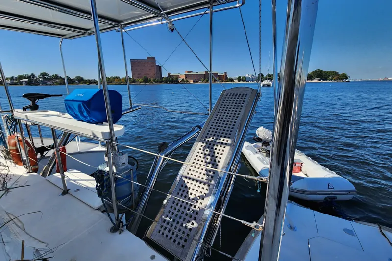 Slide: The Image of Lagoon 500 catamaran, 2008 model, docked with scenic waterfront view. - 24