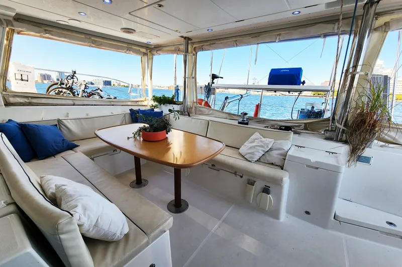 Slide: The Image of Spacious interior of 2008 Lagoon 500 yacht with comfortable seating and scenic water view. - 28