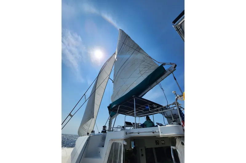 Slide: The Image of Sailing on a 2008 Lagoon 500 catamaran under clear blue skies. - 20