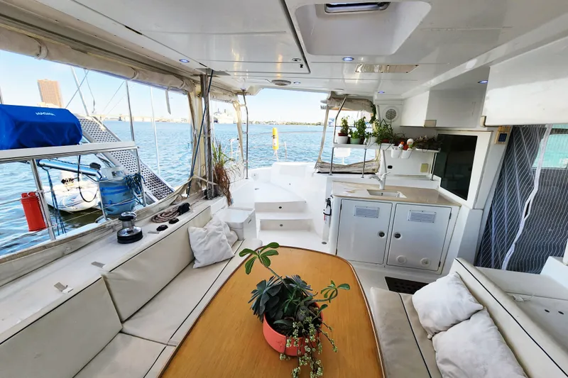 Slide: The Image of Spacious interior of 2008 Lagoon 500 yacht with seating, plants, and ocean view. - 29