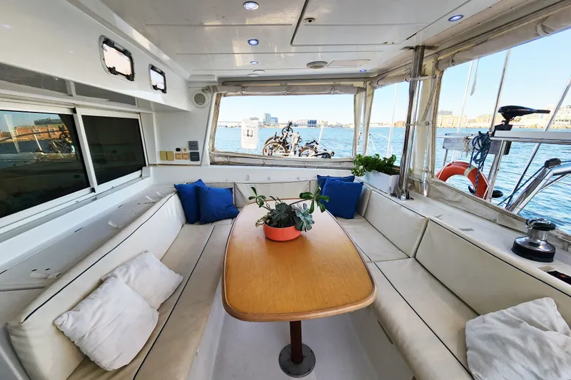 Slide: The Image of Interior of 2008 Lagoon 500 yacht with seating, table, and ocean view. - 30